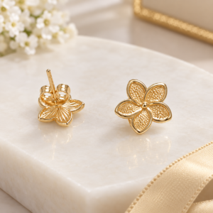 10K Gold Textured Flower Stud Earrings  Description: Delicate 10K gold flower stud earrin